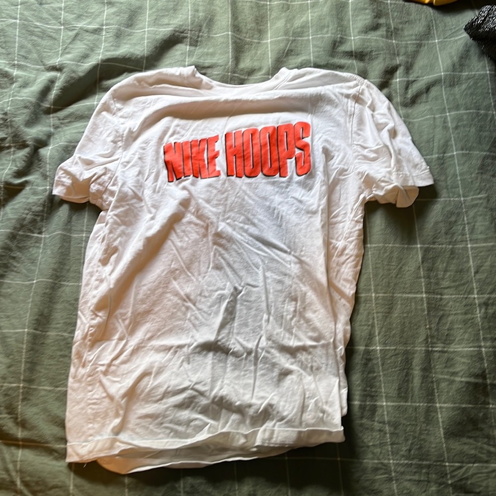 The Nike Tee shirt, size medium